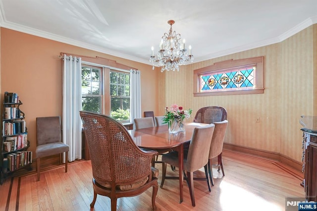 116 Sherman Ave, Teaneck, NJ 07666 - dining space featuring light wood-style floors, a chandelier, and crown molding