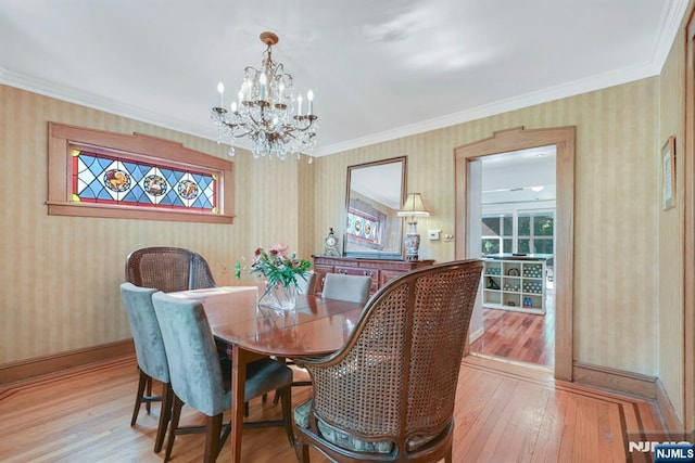 116 Sherman Ave, Teaneck, NJ 07666 - dining area featuring a chandelier, hardwood / wood-style floors, wallpapered walls, and crown molding