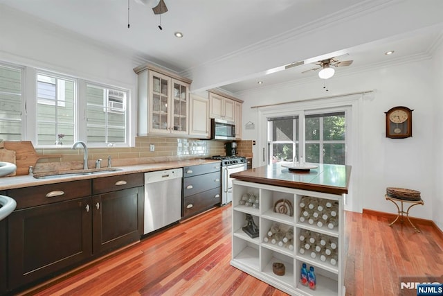116 Sherman Ave, Teaneck, NJ 07666 - kitchen with appliances with stainless steel finishes, ceiling fan, light wood finished floors, crown molding, and recessed lighting