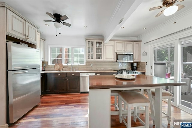 116 Sherman Ave, Teaneck, NJ 07666 - kitchen with appliances with stainless steel finishes, a ceiling fan, light wood-style flooring, crown molding, and recessed lighting
