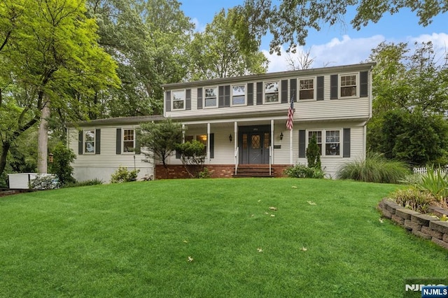 890 Ridgewood Ave, Oradell, NJ 07649 - view of front facade featuring covered porch and a front yard