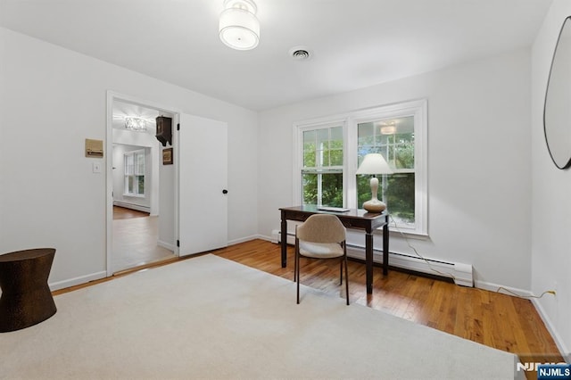 890 Ridgewood Ave, Oradell, NJ 07649 - office space featuring a baseboard heating unit and wood finished floors