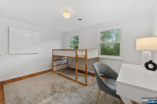 890 Ridgewood Ave, Oradell, NJ 07649 - office area with a baseboard radiator and wood finished floors