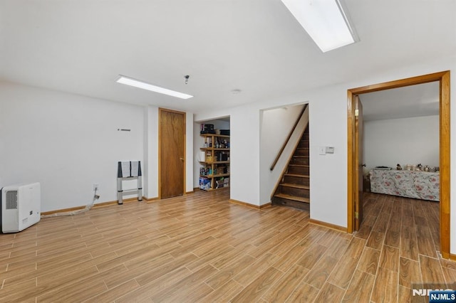 890 Ridgewood Ave, Oradell, NJ 07649 - unfurnished living room featuring light wood-type flooring and stairs