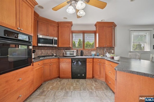 155 8th, Hawthorne, NJ 07506 - kitchen featuring black appliances, a peninsula, healthy amount of natural light, and tasteful backsplash
