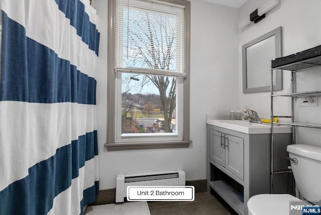87 James St, Englewood, NJ 07631 - full bath featuring vanity, a baseboard radiator, curtained shower, and tile patterned floors