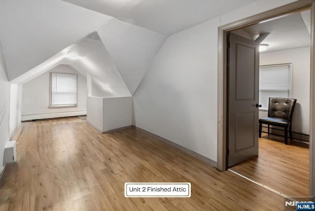 87 James St, Englewood, NJ 07631 - bonus room with baseboard heating, light wood-style flooring, and vaulted ceiling