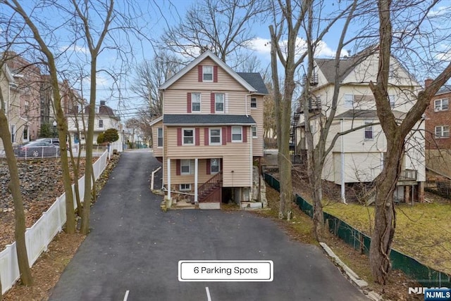 87 James St, Englewood, NJ 07631 - view of front of home with a residential view, stairs, and asphalt driveway