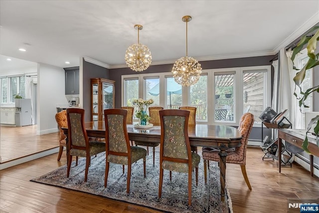 8 Oratam Rd, Upper Saddle River, NJ 07458 - dining room featuring a chandelier, ornamental molding, wood finished floors, baseboard heating, and recessed lighting