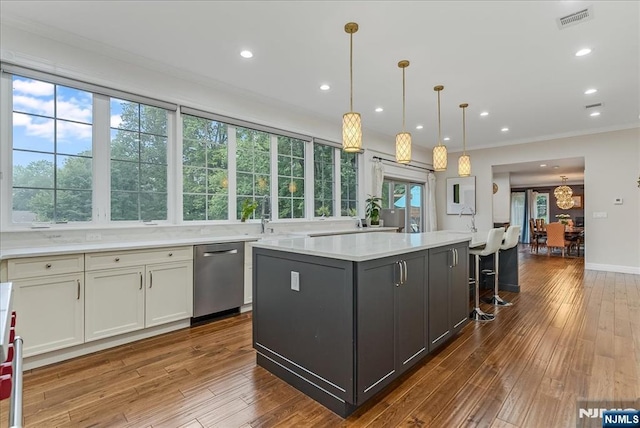 8 Oratam Rd, Upper Saddle River, NJ 07458 - kitchen with dishwasher, light countertops, a kitchen island, crown molding, and wood-type flooring