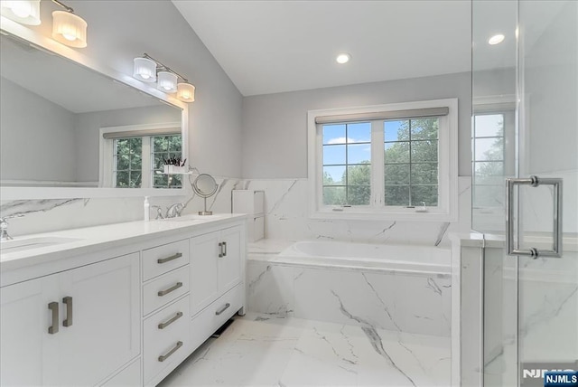 8 Oratam Rd, Upper Saddle River, NJ 07458 - bathroom featuring healthy amount of natural light, marble tiled flooring, a bath, double vanity, and recessed lighting