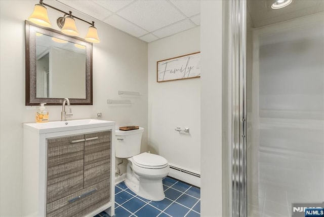 8 Oratam Rd, Upper Saddle River, NJ 07458 - bathroom with a baseboard radiator, vanity, tile patterned floors, and a drop ceiling