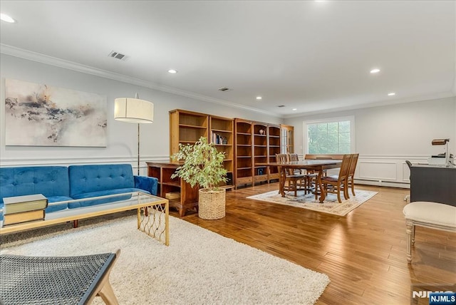 8 Oratam Rd, Upper Saddle River, NJ 07458 - living area featuring crown molding, a baseboard radiator, recessed lighting, wood finished floors, and wainscoting