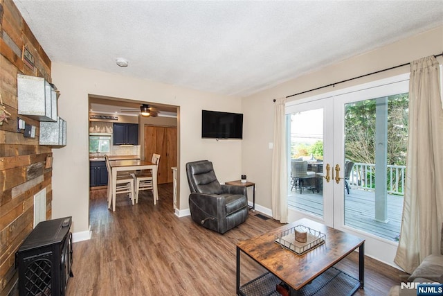 15 Mason St, Jefferson Township, NJ 07849 - living area featuring wood finished floors, ceiling fan, french doors, and a textured ceiling