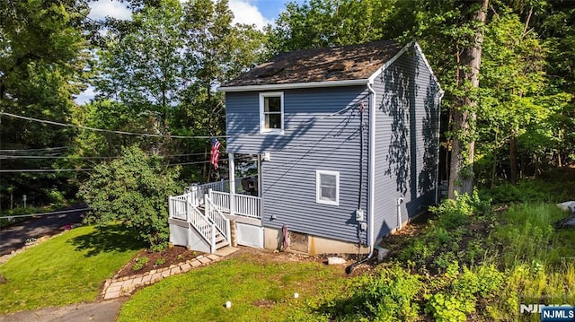 15 Mason St, Jefferson Township, NJ 07849 - view of side of home with stairs, a wooden deck, and a lawn