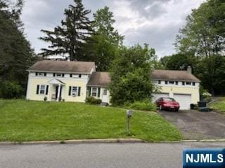2 Hilton Pl, Montvale, NJ 07645 - colonial house with asphalt driveway and a front yard