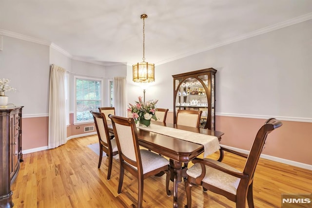 12 Jenny Ln, Wayne, NJ 07470 - dining area featuring a chandelier, light wood-type flooring, and ornamental molding