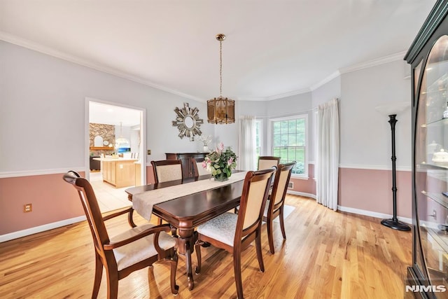12 Jenny Ln, Wayne, NJ 07470 - dining space featuring a chandelier, light wood finished floors, and crown molding