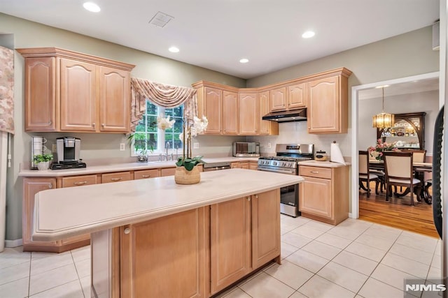 12 Jenny Ln, Wayne, NJ 07470 - kitchen featuring gas stove, under cabinet range hood, light brown cabinetry, light countertops, and recessed lighting