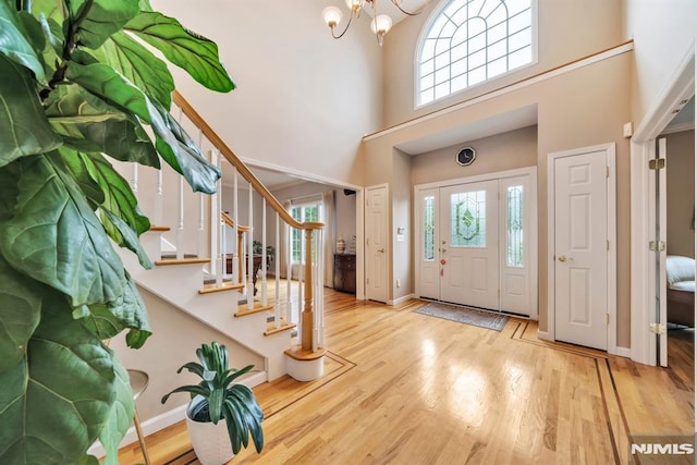 12 Jenny Ln, Wayne, NJ 07470 - foyer entrance with a high ceiling, a chandelier, stairway, and wood finished floors