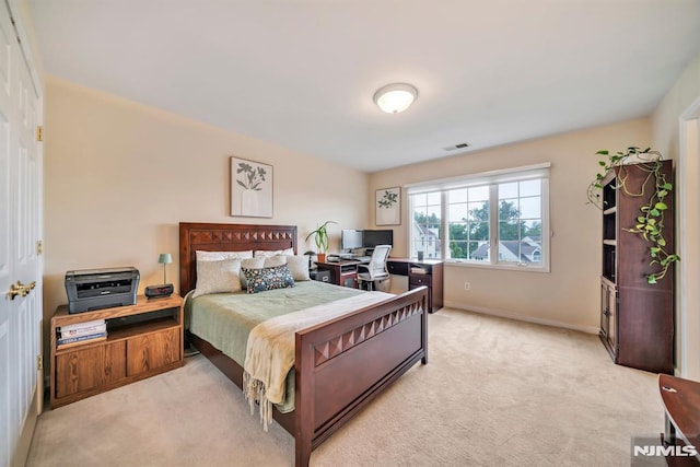 12 Jenny Ln, Wayne, NJ 07470 - bedroom with light carpet and an office area