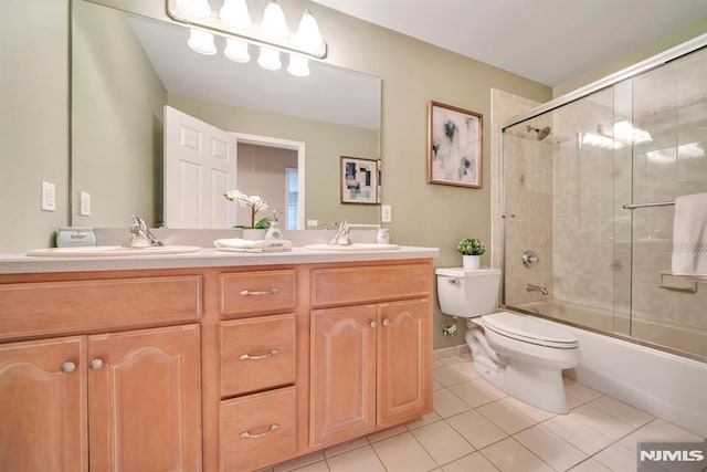 12 Jenny Ln, Wayne, NJ 07470 - bathroom featuring tile patterned floors, double vanity, and shower / bath combination with glass door