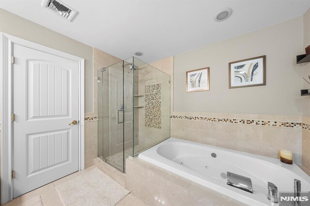 66 Andover Ter, Glen Rock, NJ 07452 - bathroom featuring a stall shower, a whirlpool tub, and tile patterned floors