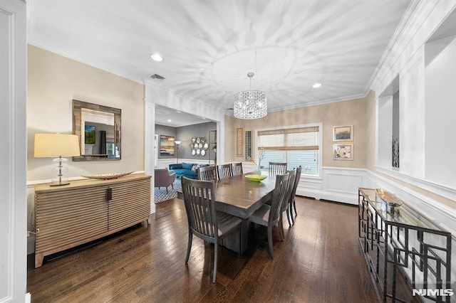 66 Andover Ter, Glen Rock, NJ 07452 - dining area with a chandelier, a wainscoted wall, ornamental molding, dark wood finished floors, and recessed lighting