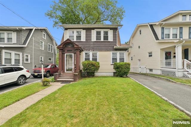 350 Walnut St, Nutley, NJ 07110 - view of front of home featuring a front yard and asphalt driveway