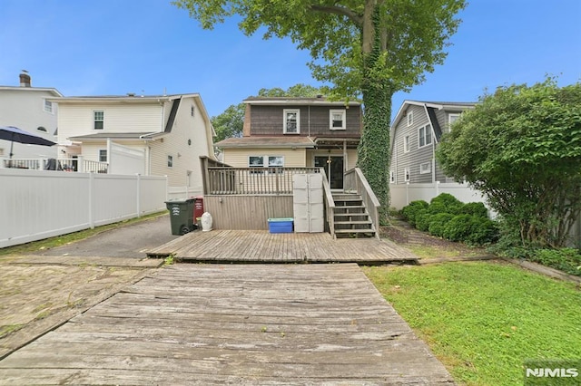 350 Walnut St, Nutley, NJ 07110 - back of property with a fenced backyard, a wooden deck, and stairway