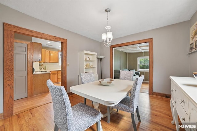 350 Walnut St, Nutley, NJ 07110 - dining space featuring light wood-type flooring and a chandelier