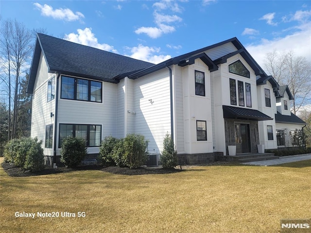 258 County Rd, Demarest, NJ 07627 - modern farmhouse featuring a front lawn and roof with shingles