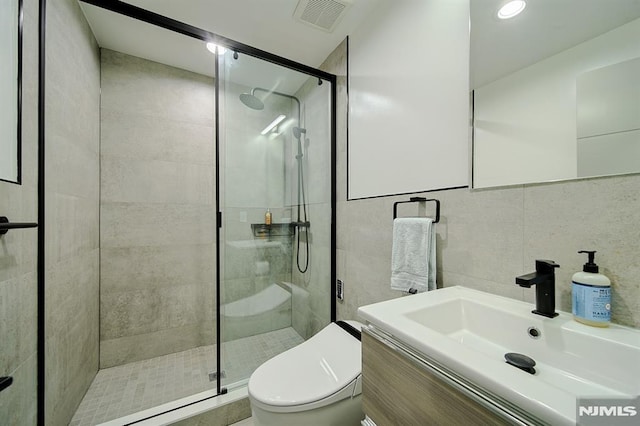 258 County Rd, Demarest, NJ 07627 - full bath featuring a shower stall, tile walls, and vanity