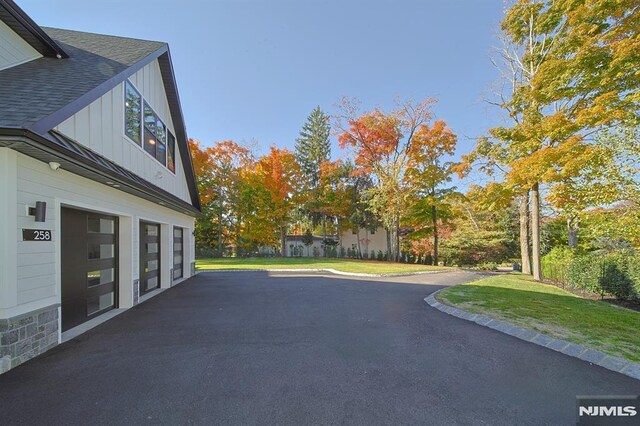 258 County Rd, Demarest, NJ 07627 - view of patio / terrace with a garage and driveway