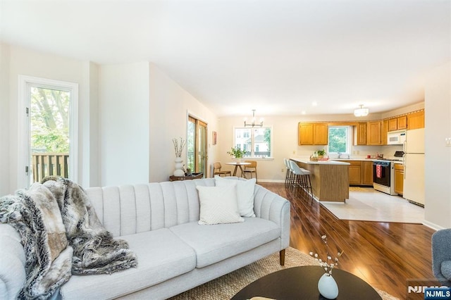 7 Di Donna Ct Unit A007, Clifton, NJ 07013 - living area featuring light wood-style flooring, a chandelier, and recessed lighting