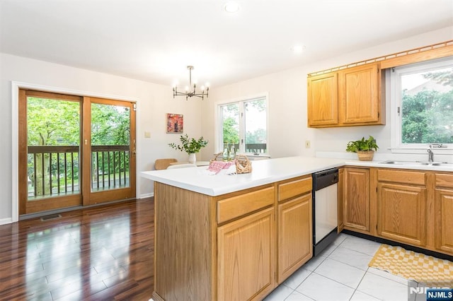 7 Di Donna Ct Unit A007, Clifton, NJ 07013 - kitchen featuring dishwasher, a peninsula, a chandelier, light countertops, and pendant lighting