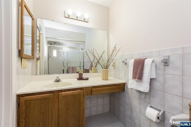 7 Di Donna Ct Unit A007, Clifton, NJ 07013 - bathroom featuring vanity, a shower stall, tile walls, and tile patterned floors