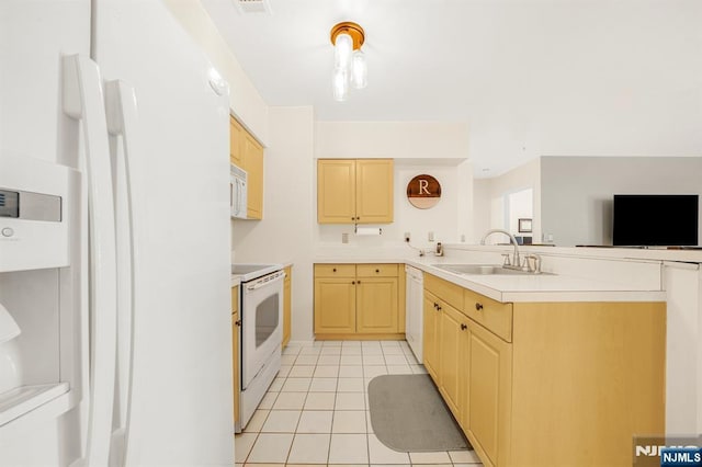2112 Schindler Ln, Wayne, NJ 07470 - kitchen featuring white appliances, light tile patterned flooring, light brown cabinets, and a peninsula