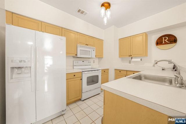 2112 Schindler Ln, Wayne, NJ 07470 - kitchen with white appliances, light brown cabinetry, light tile patterned floors, and light countertops