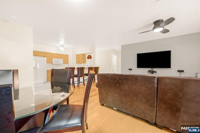 2112 Schindler Ln, Wayne, NJ 07470 - living area featuring light wood finished floors and ceiling fan