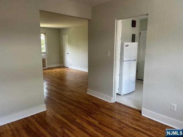 125 E Clinton Unit 10B, Bergenfield, NJ 07621 - empty room with baseboards and wood finished floors