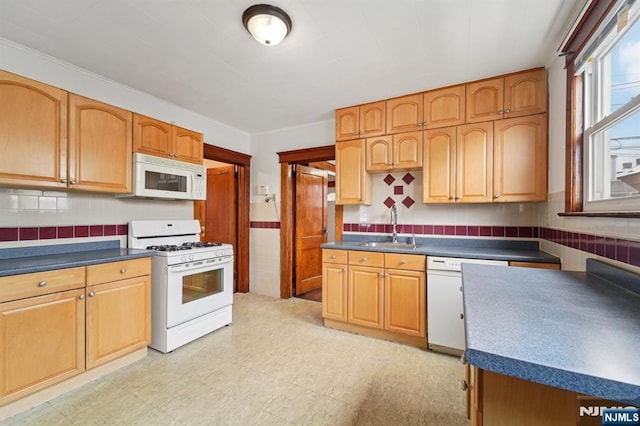 174-176 Albion Ave, Paterson, NJ 07502 - kitchen featuring white appliances, dark countertops, light floors, and decorative backsplash