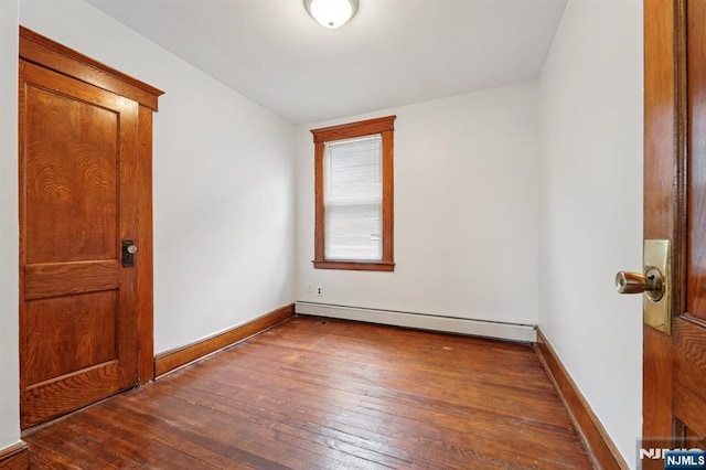 174-176 Albion Ave, Paterson, NJ 07502 - empty room featuring a baseboard radiator and wood-type flooring
