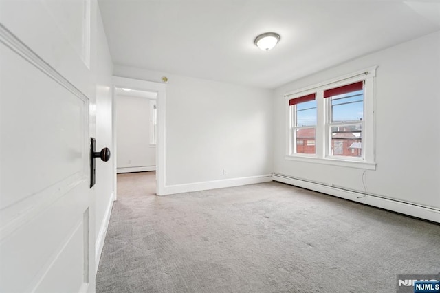 174-176 Albion Ave, Paterson, NJ 07502 - carpeted spare room with a baseboard radiator and baseboard heating