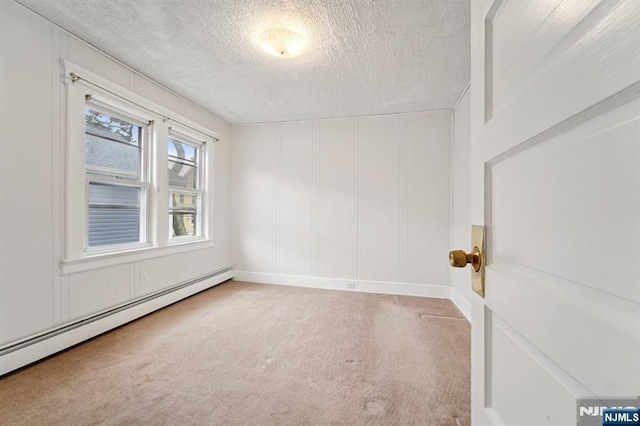 174-176 Albion Ave, Paterson, NJ 07502 - unfurnished room with carpet flooring, a baseboard heating unit, a textured ceiling, and a decorative wall