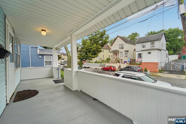 174-176 Albion Ave, Paterson, NJ 07502 - covered porch with a residential view