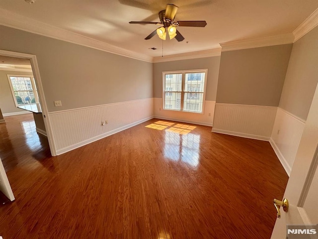 7207 Ravenscroft Rd Unit 7207, Clifton, NJ 07013 - unfurnished room with wainscoting, a ceiling fan, dark wood-style flooring, and ornamental molding