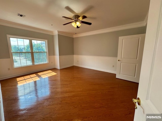 7207 Ravenscroft Rd Unit 7207, Clifton, NJ 07013 - empty room featuring dark wood-style floors, ceiling fan, crown molding, and wainscoting