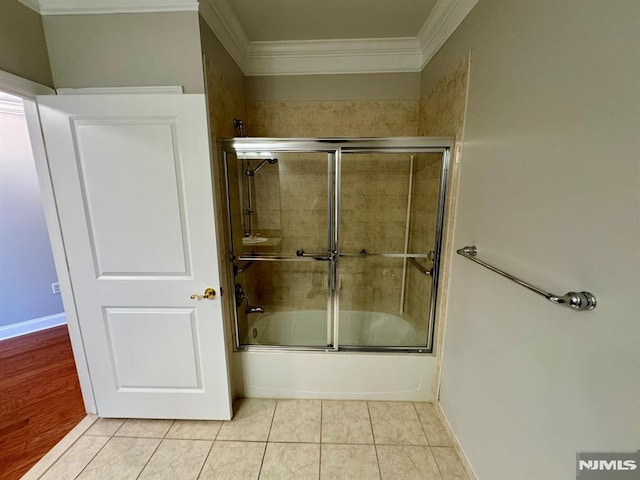 7207 Ravenscroft Rd Unit 7207, Clifton, NJ 07013 - bathroom featuring ornamental molding, combined bath / shower with glass door, and tile patterned floors