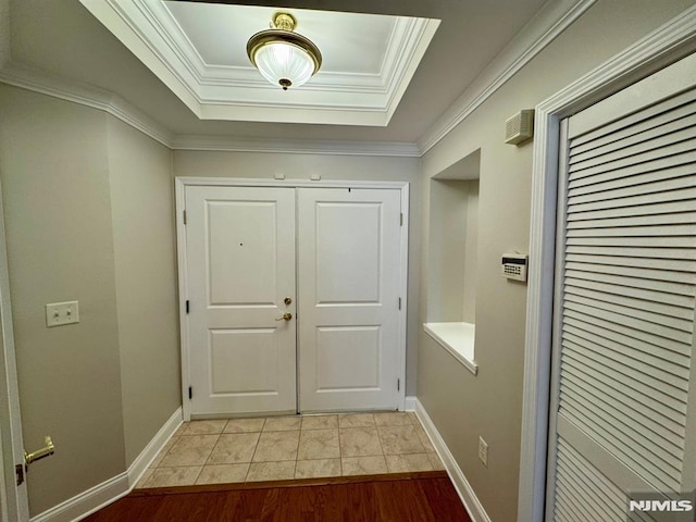 7207 Ravenscroft Rd Unit 7207, Clifton, NJ 07013 - entryway featuring a raised ceiling, crown molding, and light tile patterned flooring